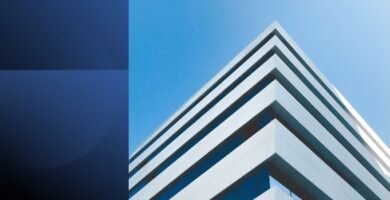 Modern office building against clear sky, symbolizing structure, confidence, and strong first impressions in communication.