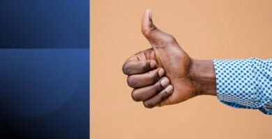 Man giving thumbs-up gesture representing the dangers of saying yes and overcommitment.