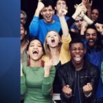 eam celebrating success together, representing how people around you affect productivity and mindset.